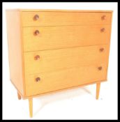 A retro 20th century Avalon teak wood chest of drawers, having a configuration of four graduating