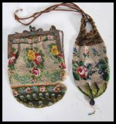 Two 19th Century Victorian beadwork purses, both having multi colour floral decoration. One having