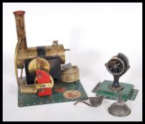 A Bowman M158 Steam Engine with flywheel, all mounted on a green metal base with 