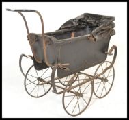 A 19th Century Victorian child's pram with metal lattice body on sprung chassis, with spoked wheels