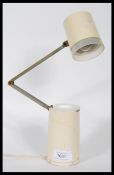 A vintage industrial Lloyds high intensity lamp model NA-101 constructed from a cream tubular body