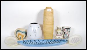 A group of mid 20th Century studio pottery to include, a bolubs vase having white ground with
