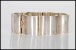 A Georg Jensen stamped 925 silver curved panel bracelet. Measures 3.5 inches wide. Weight 78.6g.