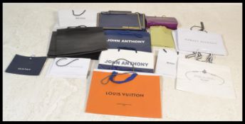 A collection of designer branded carrier bags to include Louis Vuitton, Harvey Nichols, Prada, Reiss