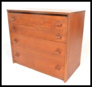 A vintage retro 20th Century Teak wood chest of four straight graduating drawers, the drawers fitted