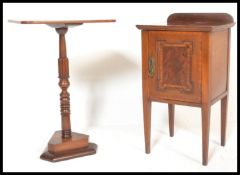 An Edwardian mahogany inlaid pot cupboard and a Victorian mahogany tripod wine table with