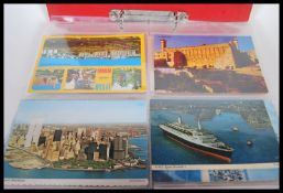 A album of early 20th Century and later postcards to include, silk cards related to war, souvenir,