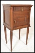French oak marble top bedside cabinet with single drawer over cupboard on turned column supports.