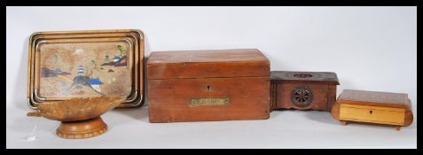 A 20th Century graduating stack of three trays, having hand painted Japanese scenes and metal