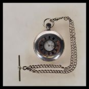 An early 29th Century Edwardian silver hallmarked half hunter pocket watch having an enamelled white