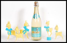 A collection of retro mid century Babycham memorabilia to include 5 deer fawns on plastic