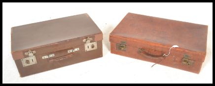 Two suitcases. One early 20th Century leather suitcases, having V. L. S. Bristol stamped to front,