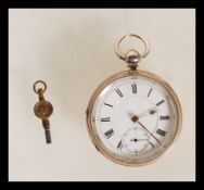 A silver hallmarked open faced pocket watch having fusee lever movement being signed for AH