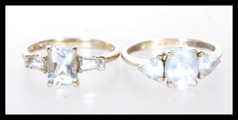 Two hallmarked 9ct gold rings to include a dress ring prong set with an oval cut white stone flanked