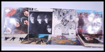 A collection of vinyl long play LP album records pertaining to The Beatles to include Please