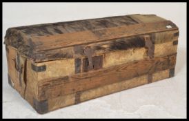 A 19th Century Boar / Pig skin iron bound steamer travel trunk, dome top with iron strap-work (