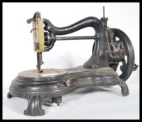 A late 19th century  sewing machine of C arch form in the manner of  Willcox & Gibbs.Measures 25cm x