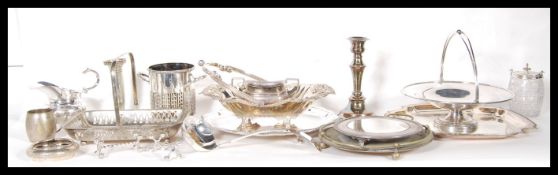 A large collection of silver plated items to include candlesticks, tray, serving dishes, tea
