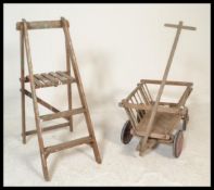 A continental believed 19th century pine children's hay cart. Original wheels with slatted angular