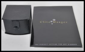 An 18ct white gold wedding band ring. Birmingham hallmarked, sponsors mark CJ. Stamped 750. Complete