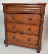 A Victorian mahogany barley twist Scottish chest of drawers. Raised on bun feet with a bank of
