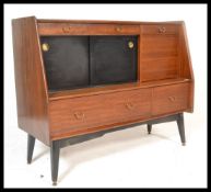 A vintage mid 20th Century G plan 'Brandon' sideboard / credenza cocktail cabinet, having a