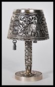A 20th Century silver/ white metal table lighter in the form of table lamp, having decorative