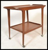 A vintage retro Mid 20th Century Danish style teak hostess trolley having two rectangular tiers with