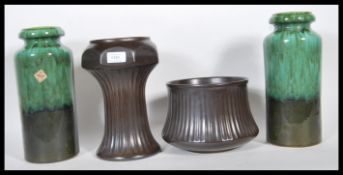 A group of four mid 20th Century West Germany pottery to include, a matching pair of green two