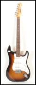 An Aria six-string STG Series electric guitar, sunburst body with white scratch guard and pick up.