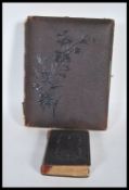 A 19th Century Victorian photograph album bound in brown leather with gilt edging, mostly containing