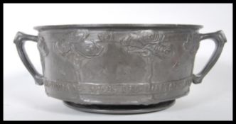 An early turn of the 20th Century David Veazey for Liberty and Co London ' Tudric ' pewter twin
