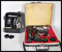 A vintage Praktica 35mm camera together with a quantity of lenses to include Sigma 1:66 Macro,