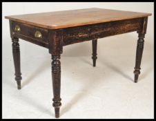 A Victorian 19th century country pine scrub top dining table. Raised on turned legs with fitted