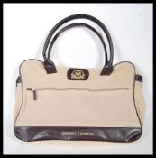 A late 20th Century Orient-Express satchel / bag, made of beige suede fabrics, having carrying