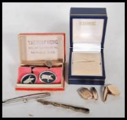 A pair of cased Bangkok Siam silver cufflinks together with a pair of gold metal cufflinks, a