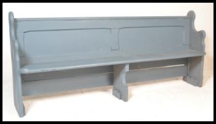 A Victorian 19th century upcycled pitch pine pew having grey painted finish. Angled body with