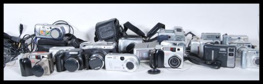 A collection of 20th and 21st Century digital cameras and accessories from various makers and