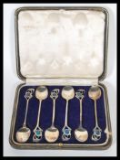 A set of six early 20th Century Arts and Crafts Cymric teaspoons by Liberty and Co designed by