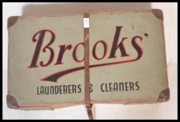 A vintage early 20th Century Industrial Brooks Laundry advertising cardboard box having red