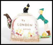 A  20th Century 1930's/40's novelty teapot by Bancroft & Bennett Staffordshire. The handle in the
