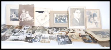 A collection of family photographs dating from the late 19th Century, the photographs ranging from