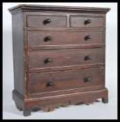 A Victorian 19th century apprentice piece miniature chest of drawers  of stained pine