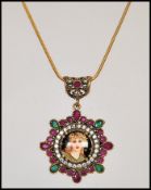A silver Renaissance style pendant necklace, having central panel depicting a lady surrounded with a