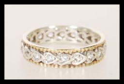 A 9ct gold 375 full eternity ring having white stones. Assay marks for Birmingham, date letter M.