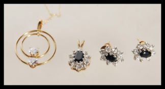 A selection of stamped 9ct gold jewellery to include a pendant necklace having a circular pendant