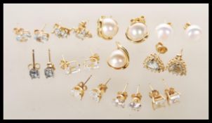 A collection of vintage gold stud earrings to include a pair of stamped 375 gold earrings set with