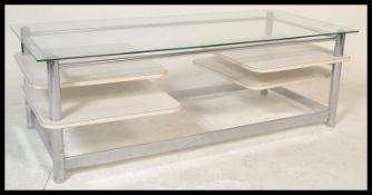 A retro 20th Century circa 1980's glass topped rectangular coffee table raised on chrome supports