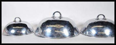 A set of three graduating late 19th Century / early 20th Century silver plated meat cloches / covers