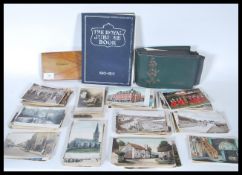 A collection of early 20th Century postcards mostly black and white and coloured scenes from UK